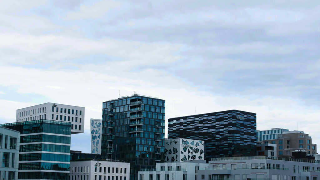 Downtown Oslo: Urban high-rises against overcast sky.