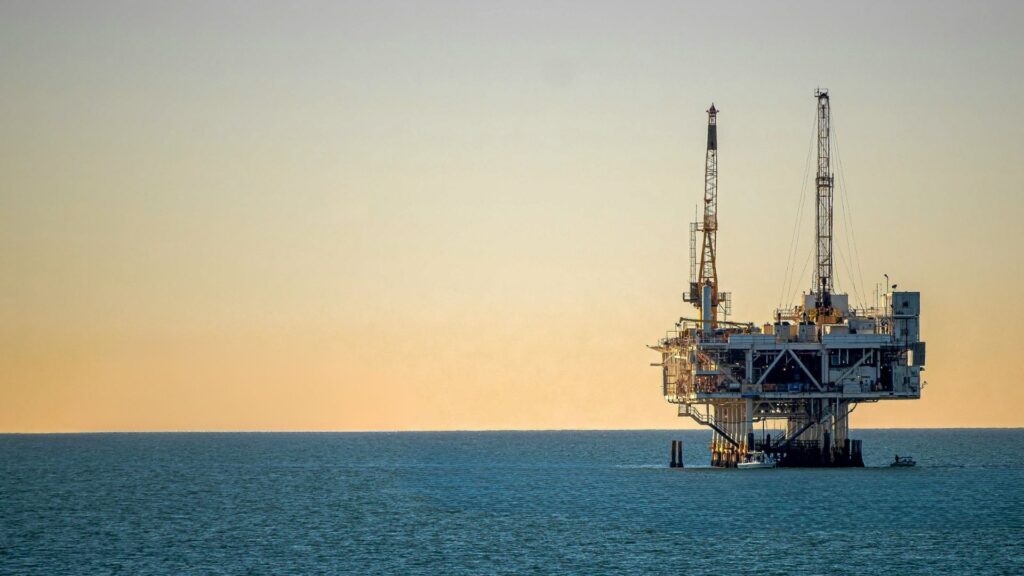 An oil rig in the sunset.